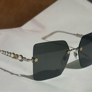 Gucci Women's Sunglasses with Black Lenses and Gold Details